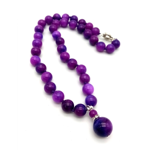 963 - A Purple Sugalite Stone Beaded Necklace and Pendant. 10mm beads and 12mm pendant bead. Necklace - 42... 