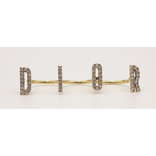 1022 - An iconic and rare, three finger CHRISTIAN DIOR spell-out ring designed by John Galliano, one of the... 