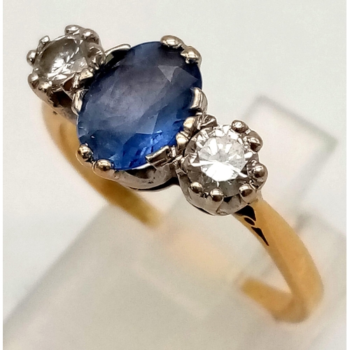 198 - A Vintage 18K Yellow Gold Pale Blue Sapphire and Diamond Ring. Central 1ct sapphire with a brilliant... 