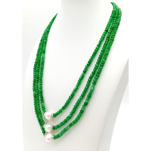 345 - A Three Row Faceted Green Emerald and Pearl Necklace.
42-46cm