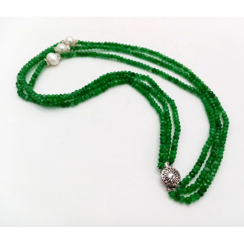 345 - A Three Row Faceted Green Emerald and Pearl Necklace.
42-46cm