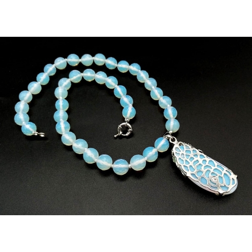 430 - A Moonstone Bead and Pendant Necklace. 10mm beads. Pendant - 4.5cm. Necklace - 40cm