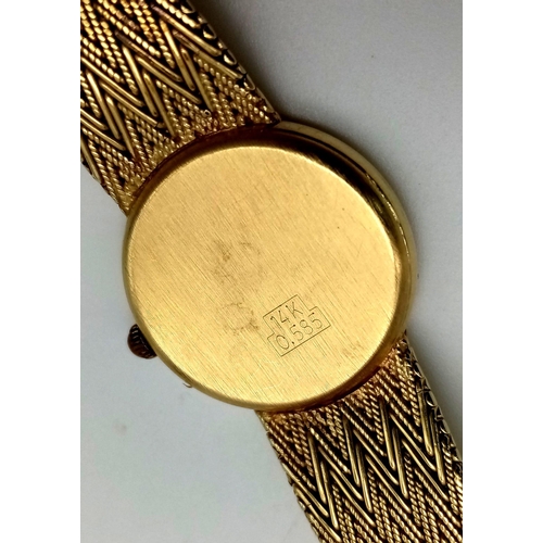 52 - A 14K Solid Gold Bouchard Ladies Watch. Solid gold strap and case -  20mm. Quartz movement. In very ... 