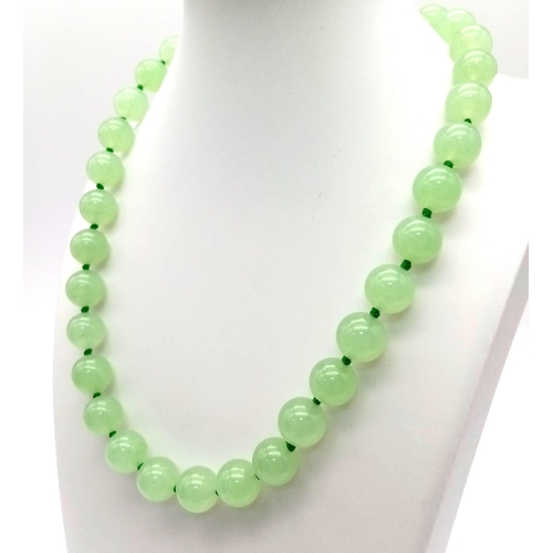 582 - A Light Green Jade Necklace, Bracelet and Earring Set. 12mm beads. 42cm necklace. Expandable bracele... 