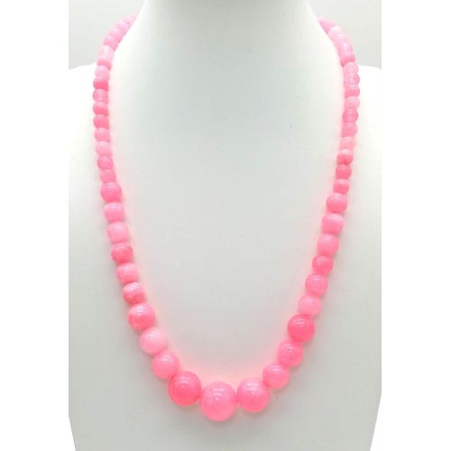 693 - A Graduated Pink Snowflake Jade Necklace. 6-14mm beads. Necklace - 42cm.