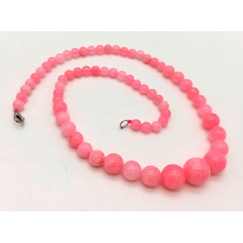 693 - A Graduated Pink Snowflake Jade Necklace. 6-14mm beads. Necklace - 42cm.