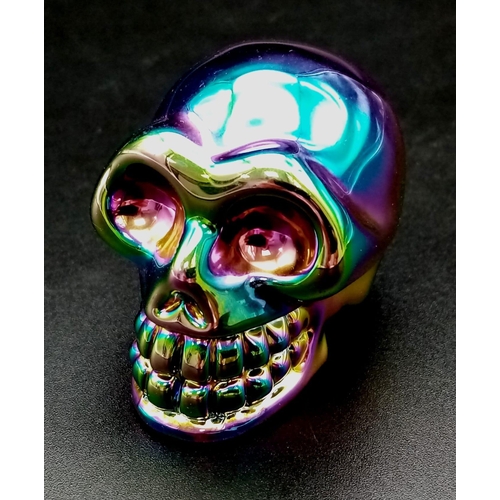 723 - A Titanium Coloured Fluorite Crystal Skull. 5cm.