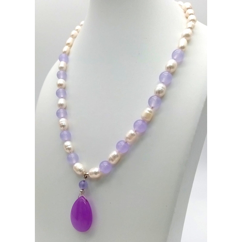 933 - A Cultured Pearl and Pink Jade Bead Necklace with a Pink Jade Teardrop Pendant - 4cm. Necklace - 42c... 