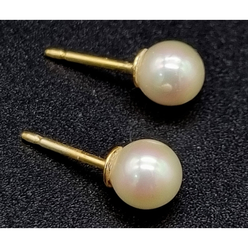 827 - Two Pairs of 9K Yellow Gold Pearl Earrings - without fasteners. 2.76g total weight.