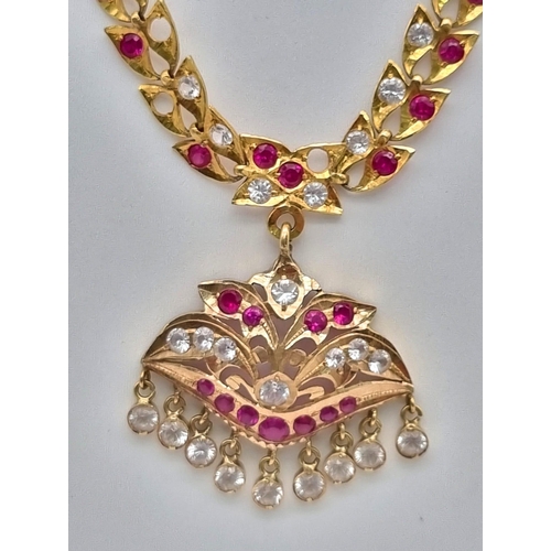 106 - A Mixed High Karat Gold Lot to Include: 2 x 18k gold bangles - 15.86g total weight. A necklace with ... 