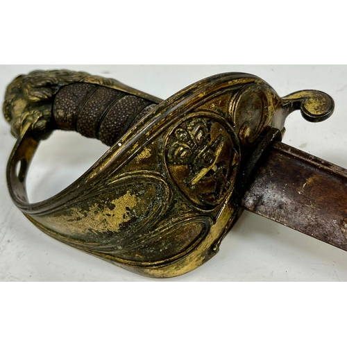 391 - An 1827  Royal Navy Pipebacked Sword. Lion head pommel with shagreen grip. Regulation guard with cro... 