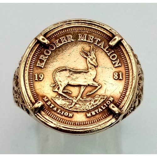 44 - A 9K Gold Krooker Metalion Coin Ring. Size W 1/2. 6.17g. Ref: 1334.