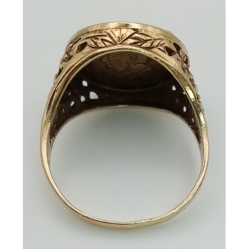 44 - A 9K Gold Krooker Metalion Coin Ring. Size W 1/2. 6.17g. Ref: 1334.