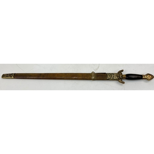 453 - An Antique Short-Sword Possibly of Indian Origin. Snakeskin and brass scabbard. Decorated blade. Bra... 