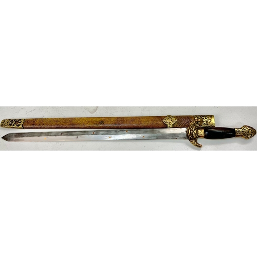 453 - An Antique Short-Sword Possibly of Indian Origin. Snakeskin and brass scabbard. Decorated blade. Bra... 