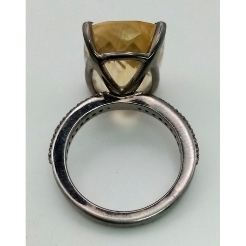 400 - A 14.70ct Natural Citrine Ring set in 925 silver, decorated with 0.28ct Diamond on the wings. Size N... 