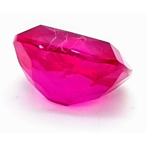 133 - A very desirable, large (67.67 carats), fuchsia red RUBY. Cushion cut, with perfect, uniform, vivid ... 