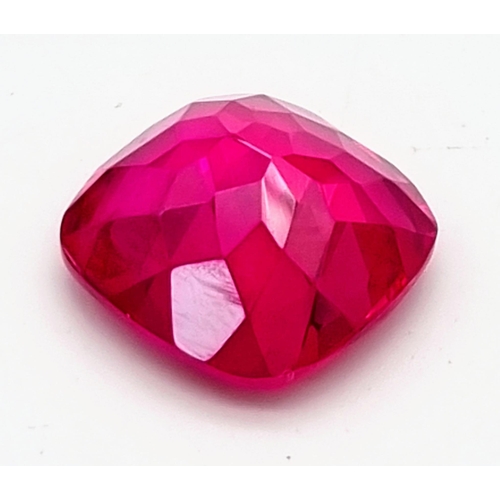 133 - A very desirable, large (67.67 carats), fuchsia red RUBY. Cushion cut, with perfect, uniform, vivid ... 