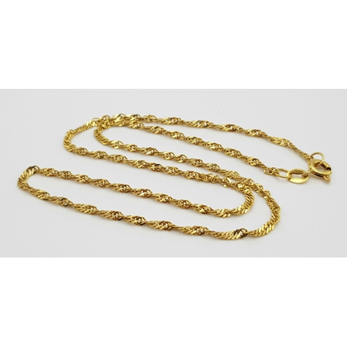 268 - A 20K Yellow Gold Necklace - 40cm and two pairs of 20k yellow gold earrings. Total weight - 6.8g. Re... 