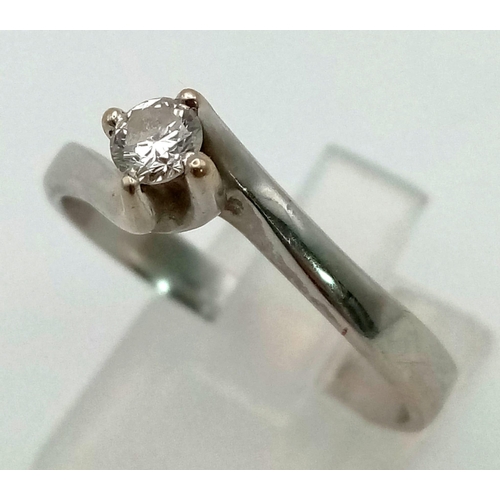 304 - An 18K White Gold Diamond Solitaire Ring. 0.2ct brilliant round cut diamond. Size U. 4.6g total weig... 