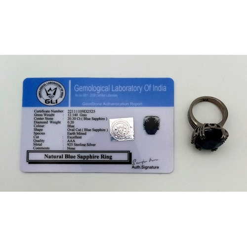 414 - A 20.30ct Oval cut Natural Blue Sapphire Ring set in 925 silver, decorated with 0.20ct Diamond Accen... 