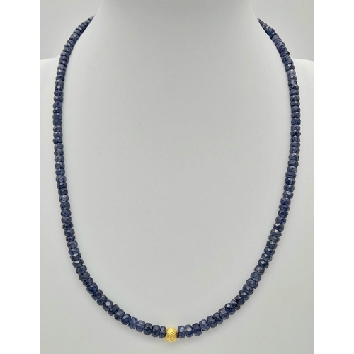 421 - A 99ct single strand Blue Sapphire Necklace with a gilded bead and 18K gold plated clasp. 
Length: 4... 