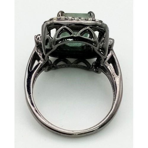 547 - A 3.20ct Natural Emerald Ring set in 925 silver, decorated with a 0.44ct Diamond surround and furthe... 