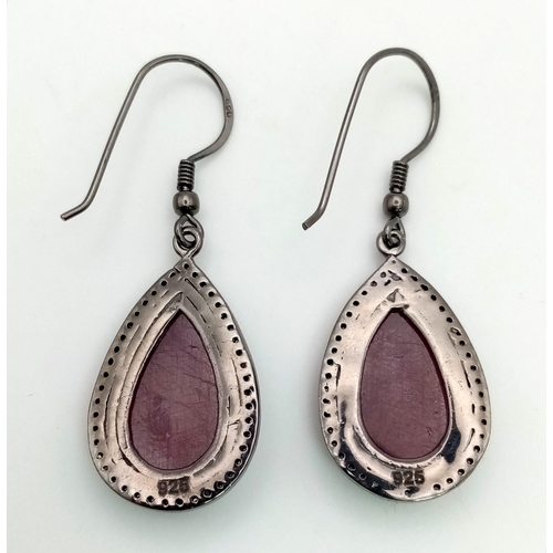 554 - A Pair of 14ct Natural Ruby Teardrop Dangler Earrings, set in 925 Black Antique Finish silver, decor... 