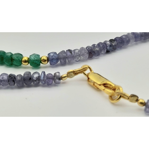 745 - An 80ct Single Strand Tanzanite and Emerald Bead Necklace with gilded spaces and 925 gilded clasp. 
... 