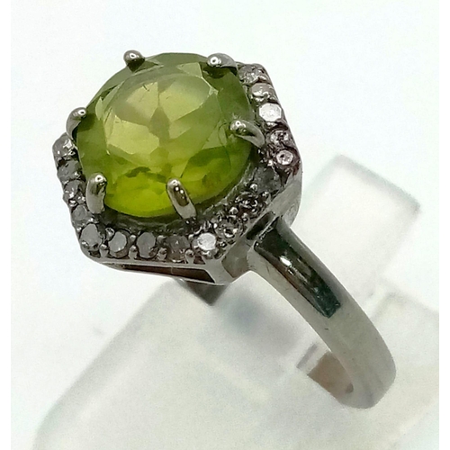 752 - A 2.90ct Natural Peridot Ring set in 925 silver, decorated with a 0.26ct Diamond surround. Size N. T... 