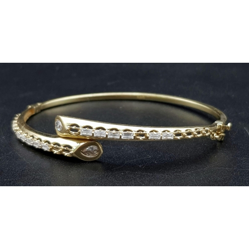 977 - A 14K Yellow Gold Jewellery Lot to Include: Three bangles A/F due to missing stones and kinks plus t... 