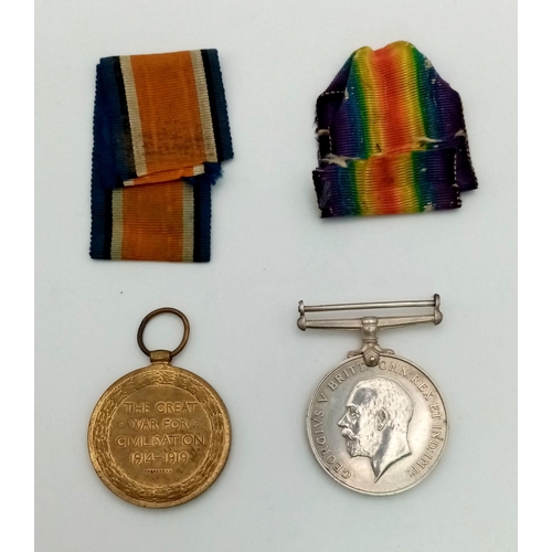 450 - WW1 British Medal Duo and a piece of shell shrapnel in a Princess Mary Xmas Tin. Awarded To: 43607
P... 