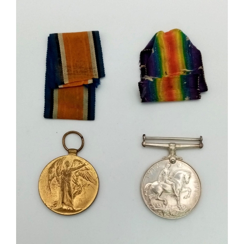 450 - WW1 British Medal Duo and a piece of shell shrapnel in a Princess Mary Xmas Tin. Awarded To: 43607
P... 