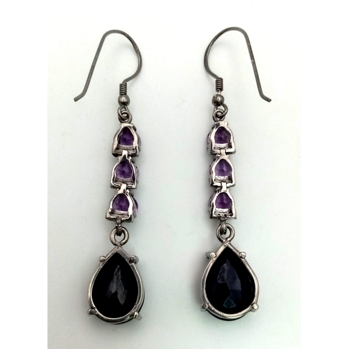 773 - A pair of Blue Sapphire Dangler Earrings with 0.17ct Diamond and 4ct Amethyst Gemstones, 
total weig... 