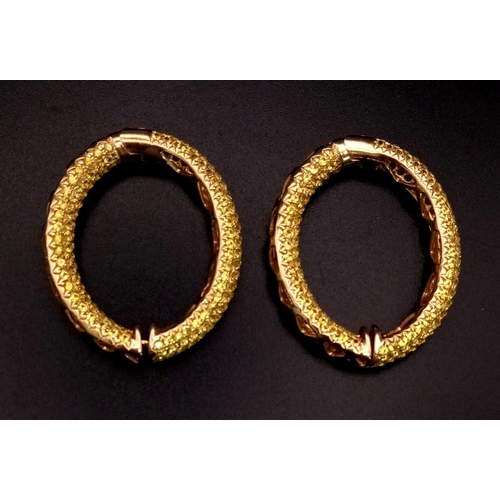 679 - An 18K Yellow Gold and Yellow Stone Pair of Hoop Earrings.
19.16g total weight. Ref: 3710.