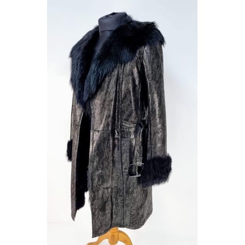 105 - A sophisticated and fashionable YVES SAINT LAURENT real fur lined, knee length, leather coat, crafte... 