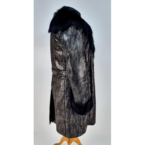 105 - A sophisticated and fashionable YVES SAINT LAURENT real fur lined, knee length, leather coat, crafte... 