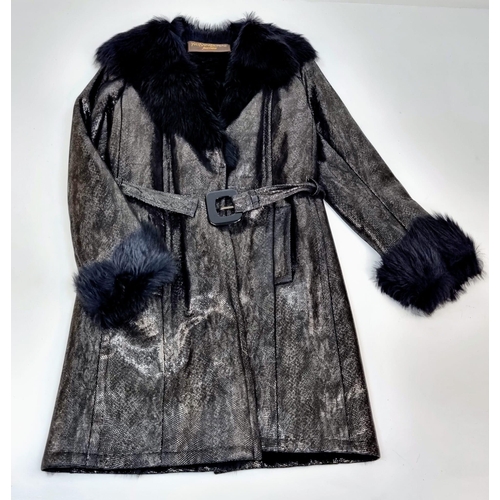 105 - A sophisticated and fashionable YVES SAINT LAURENT real fur lined, knee length, leather coat, crafte... 