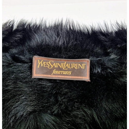 105 - A sophisticated and fashionable YVES SAINT LAURENT real fur lined, knee length, leather coat, crafte... 