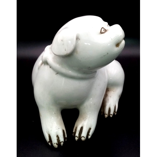 83 - AN ANTIQUE JAPANESE HIRADO PORCELAIN OKIMONO FIGURE OF A PUPPY FROM THE EDO PERIOD . 17cms LONG AND ... 