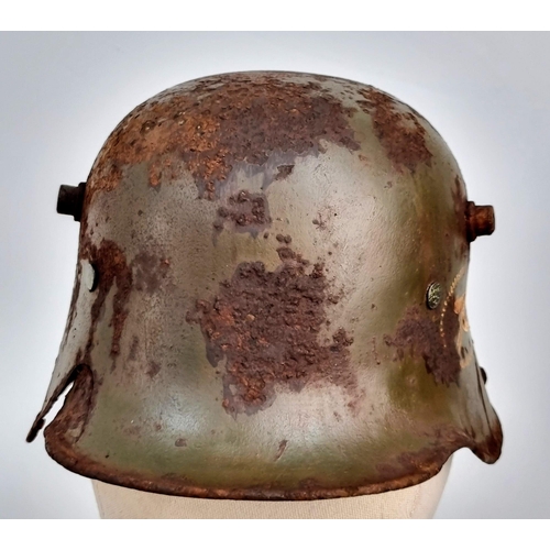 172 - WW1 Imperial German M16 Stahlhelm with Machine Gunners Insignia and Battle Damage.