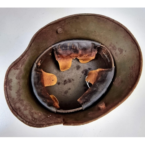 172 - WW1 Imperial German M16 Stahlhelm with Machine Gunners Insignia and Battle Damage.