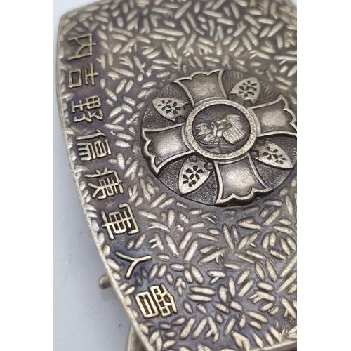 309 - A VERY RARE JAPANESE SILVER BELT BUCKLE AWARDED TO SEVERELY WOUNDED OFFICERS .  5.3cms x 4.6cms.  ci... 