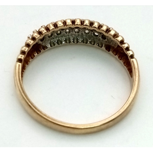 326 - A 9k gold band ring with beaded edging set with an estimated 0.20ct diamonds. Size P. Weight 2.6g