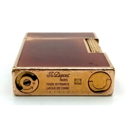 382 - A Vintage ST Dupont Gold Plated Chinese Brown Lacquer Lighter. In good condition but needs some gas ... 