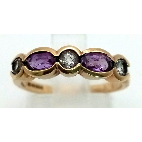 719 - A 9k gold amethyst and white topaz band ring. Size M. Weight 2.2g