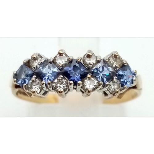 786 - A 9k gold tanzanite and cubic zirconia ring. Size O. Weight 1.75g