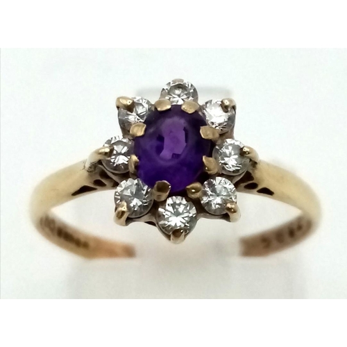 916 - A 9K Yellow Gold Amethyst and CZ Cluster Ring. Size L 1/2 . 1.7g total weight.