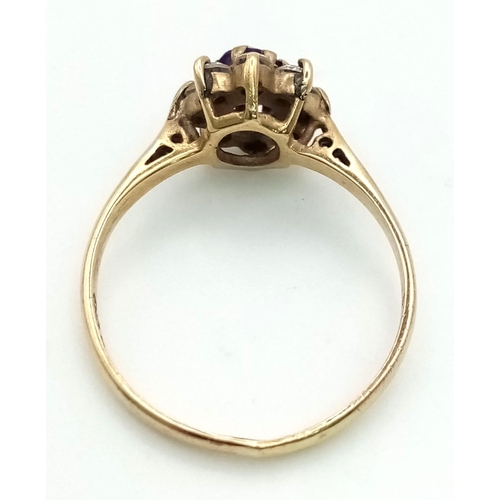 916 - A 9K Yellow Gold Amethyst and CZ Cluster Ring. Size L 1/2 . 1.7g total weight.