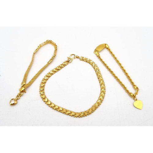 110 - A Mixed Gold Lot to Include: A 22K yellow gold selection of 10 bangles - 103.7g total weight - A/F. ... 